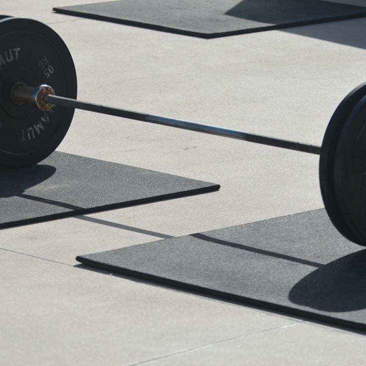 Interior of a professional gym with weight training equipment and mirrors